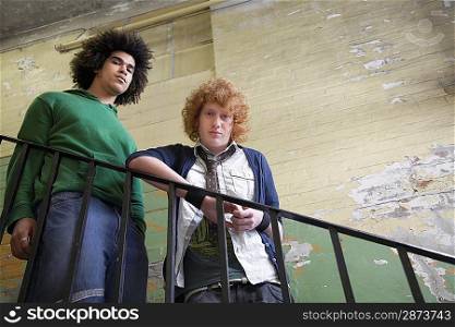 Two Young Stylish Men on Dilapidated Stairway