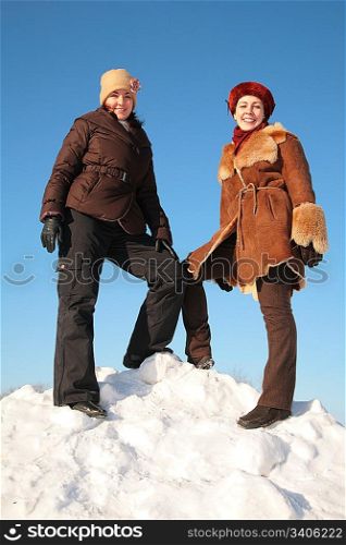 two young woman on snow hill