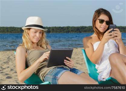 two young woman on the beach