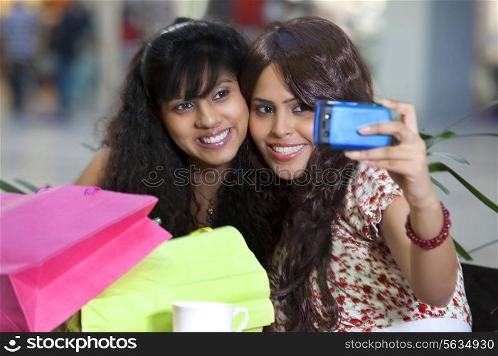Two young woman taking self portrait