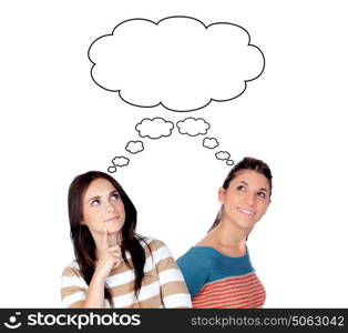 Two young woman thinking about the same idea isolated on a white background