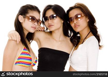 Two young women and a teenage girl wearing sunglasses