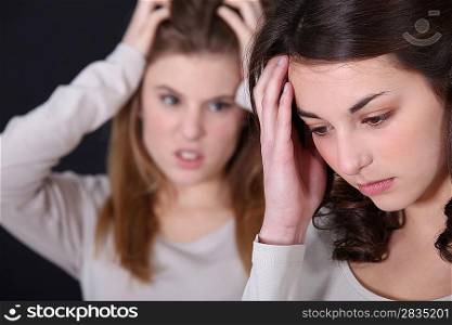 Two young women arguing