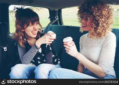 Two young women doing together a road trip