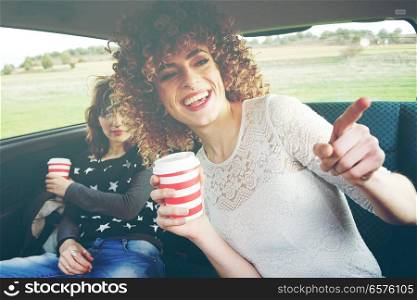 Two young women doing together a road trip