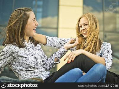 Two young women flirting and having fun