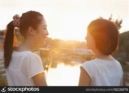Two Young Women Looking at Sunset