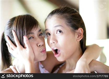 Two young women making faces