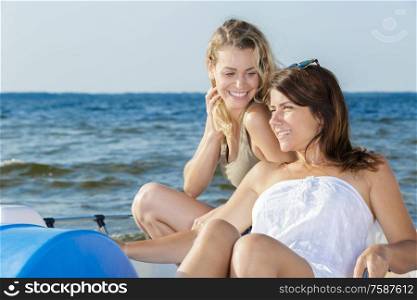 two young women on pedalo