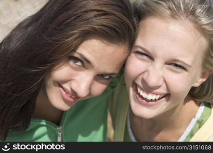 Two young women posing outdoors