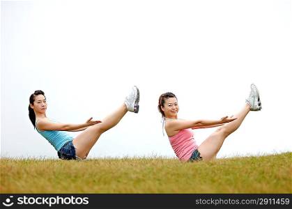 Two young women practising Gymnastics