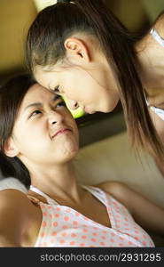 Two young women rough housing