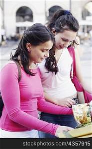 Two young women shopping