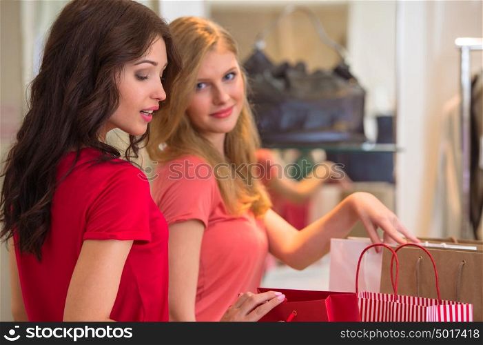 Two young women shopping in mall