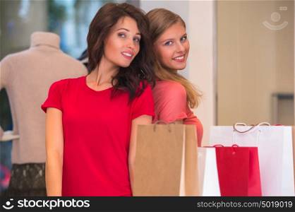 Two young women shopping in mall