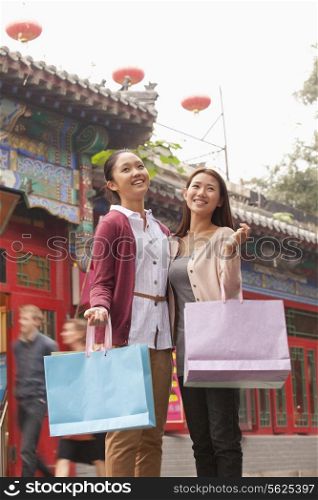 Two Young Women Shopping Outdoors