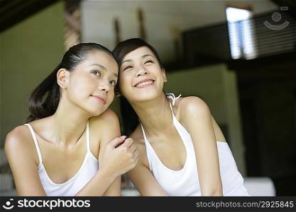 Two young women sitting together