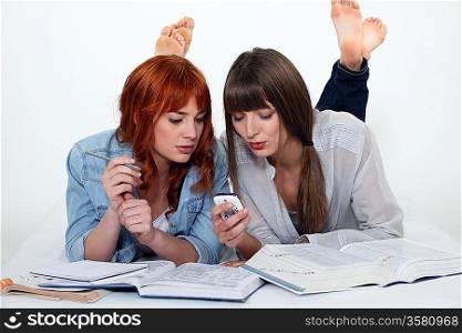 Two young women studying together