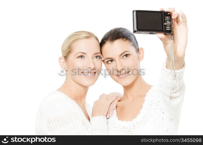 two young women taking pictures of themselves, isolated on white