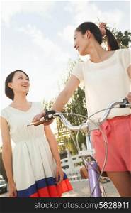 Two Young Women with Bicycle