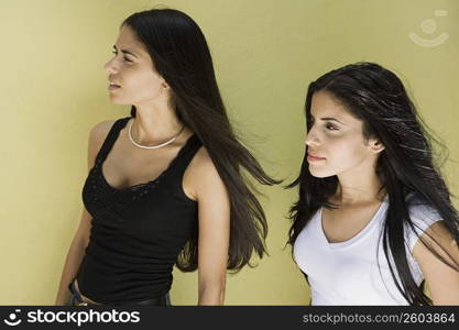 Two young women with long hair