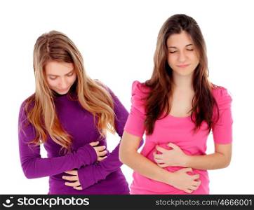 Two young women with stomach pain isolated on a white background