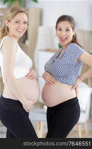 two young young pregnant women