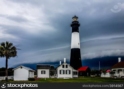 tybee island beach lighthouse with thunder and lightning