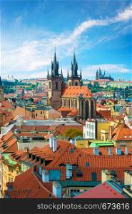 Tynsky and St Vita cathedrals among the red roofs of Prague. View from above