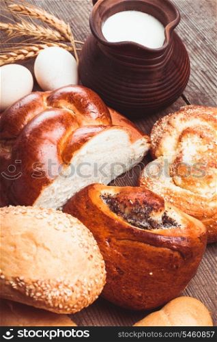 Types of homemade bread and jug with milk