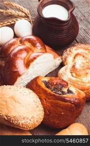 Types of homemade bread and jug with milk