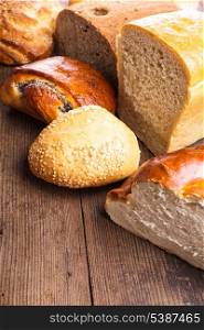 Types of homemade bread on the rustic wooden table