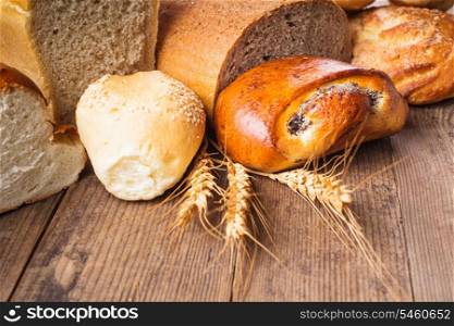 Types of homemade bread on the rustic wooden table
