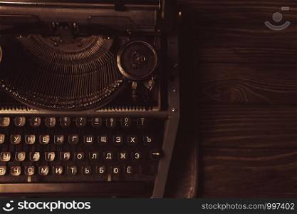 typewriter in retro style on wooden background.. typewriter in retro style on wooden background