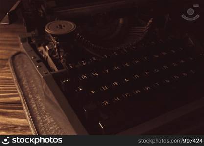 typewriter in retro style on wooden background.. typewriter in retro style on wooden background