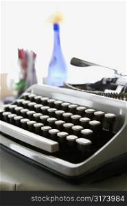 Typewriter sitting on counter.