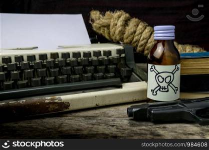 Typewriter with paper page and poison and gun. Concept writer Romance Suspense