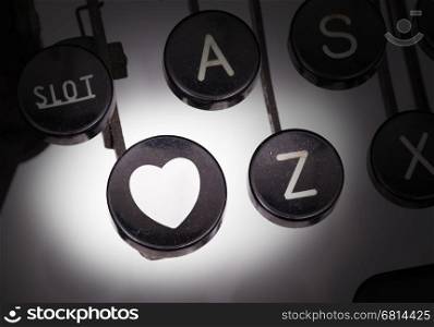 Typewriter with special buttons, heart