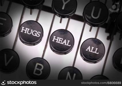 Typewriter with special buttons, hugs heal all