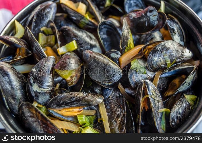 Typical Belgian dish, a plate of steamed mussels, usually accompanied by French fries (moules frites)