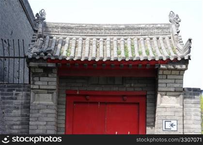 Typical Chinese historic building with a red door