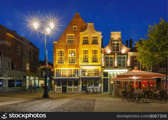 Typical Dutch houses on the Markt square in the center of the old city at night, Delft, Holland, Netherlands