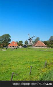 Typical Dutch landscape with windmill