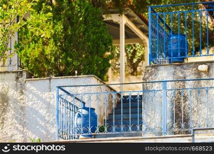 Typical Greek architecture details concept. Blue fence outdoor house during summer weather.. Blue fence outdoor