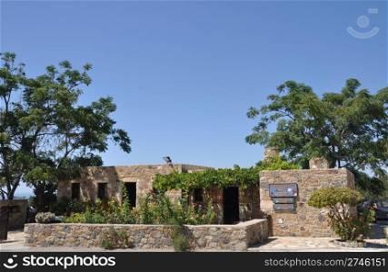 typical greek stone house with lovely garden in Antimahia (Kos), Greece