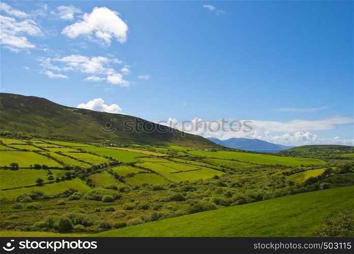 Typical green Irish country side with blue sky and cluds