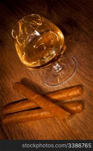 typical havana cigars with pure whisky drink background