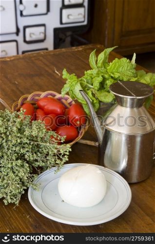 Typical italian cuisine ingredients as oil, oregano and tomatoes