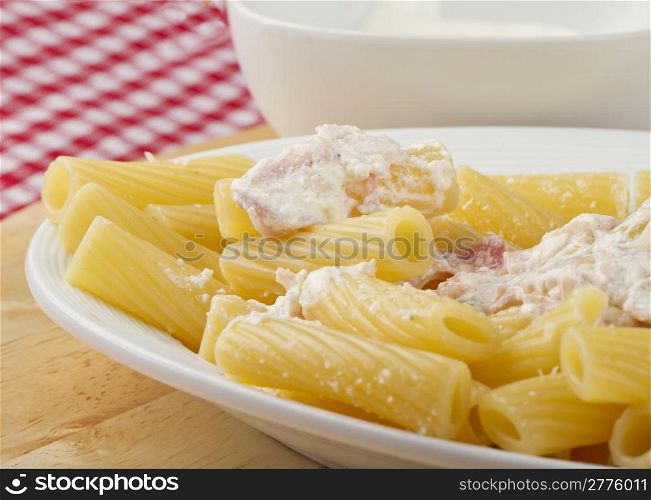 Typical Italian pasta maccheroni with ham and cream