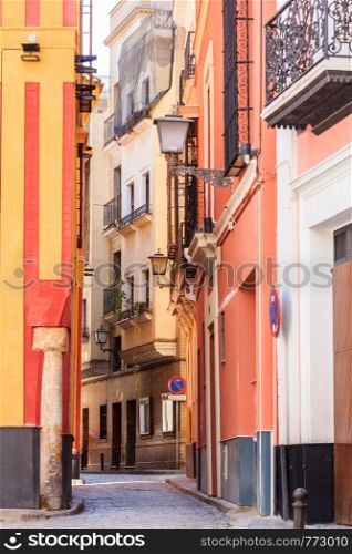 Typical narrow street in old Seville, Spain